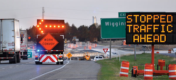 highway work zone with portable changeable message sign in use