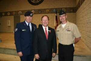 Mike Guidry and Stewart Denner with U.S. Representative Bill Flores.