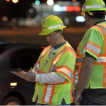 This is a photo of two safety belt surveyors at night.