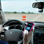 This is a photo of Christina Yager texting on her cell phone while driving.