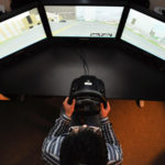 overhead view of person operating driving simulator