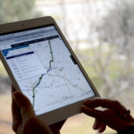 Person viewing the I-35 traveler map on an iPad.