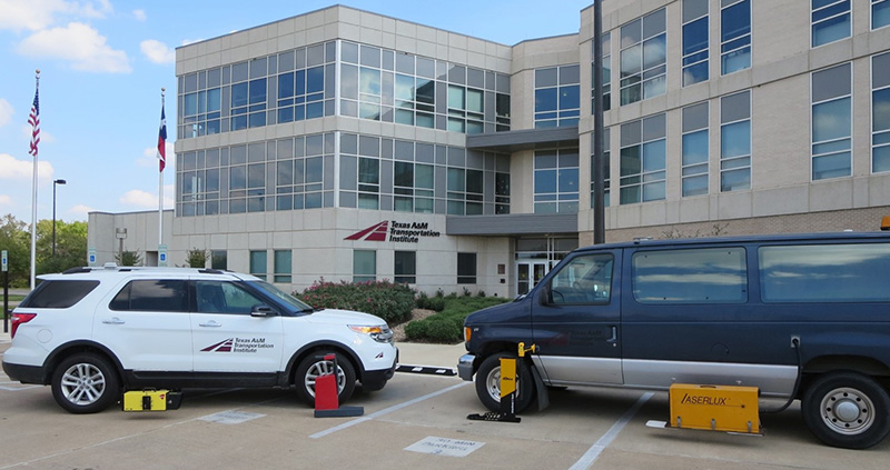 TTI’s pavement marking retroreflectivity equipment parked in front of TTI's headquarters building
