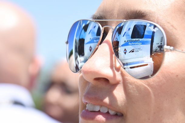 A photo showing the reflection of the trucks in a pair of sunglasses.