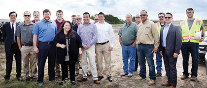 group photo of people involved with the planning and construction of TTI's new headquarters building
