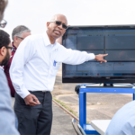 A TTI researcher demonstrates a connected vehicle test application.