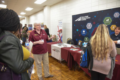 TTI Research Scientist Sue Chrysler speaks with students at a STEM event.