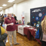 TTI Research Scientist Sue Chrysler speaks with students at a STEM event.