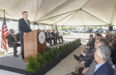 Texas Lieutenant Governor Dan Patrick speaking at a ribbon cutting ceremony.