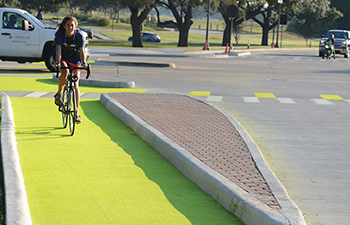 An unsignalized Dutch junction on the Texas A&M campus after installation of luminescent bicycle pavement markings.