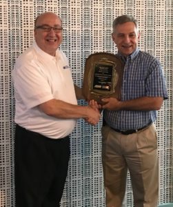 TTI Research Engineer Gene Hawkins is awarded the John "Jake" Landen Memorial Highway Safety Award by ARTBA Senior Vice President Brad Sant.
