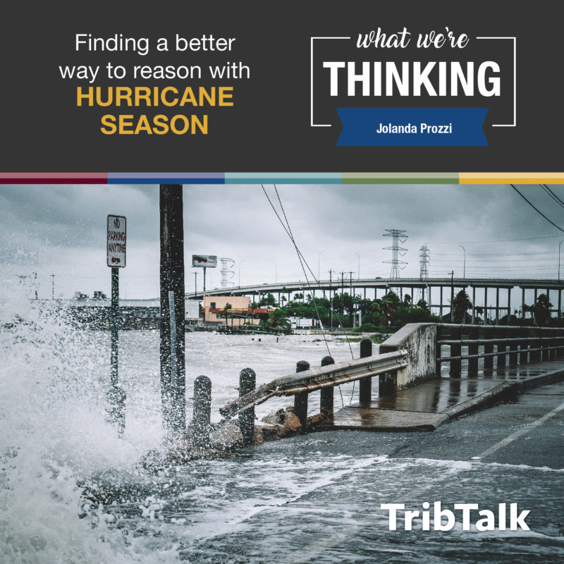 Text: Finding a better way to reason with hurricane season | What We're Thinking | Jolanda Prozzi | Trib Talk. photo: Flood waters on a roadway during a hurricane. 
