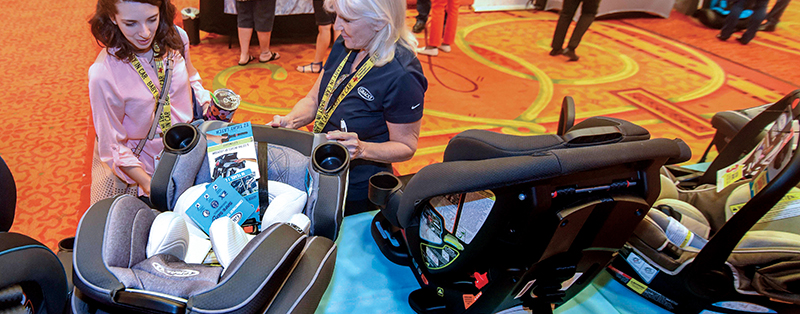 Child Passenger Safety Conference participants visiting with vendors in conference exhibit area