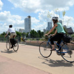 Bicyclists on a roadway bike path.