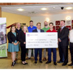 Youth Transportation Safety Program team members accept a check from Union Pacific representatives.