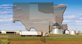 Transport truck along a rural highway with states of the Southwest Agricultural Region (Arkansas, Louisiana, New Mexico, Oklahoma, and Texas) as an overlay.