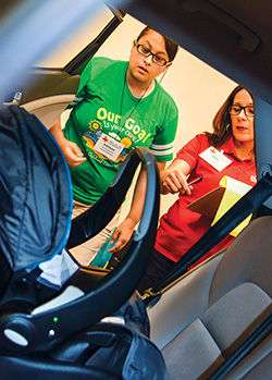 Seat check participant and instructor during the 2019 Texas Child Passenger Safety Conference.