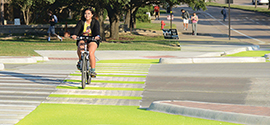 The Dutch-style unsignalized intersection at Texas A&M University with solar luminescent green paint bicycle pathways.