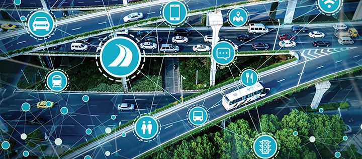 Illustration of various connected technology overlaying an aerial view of a busy highway interchange.