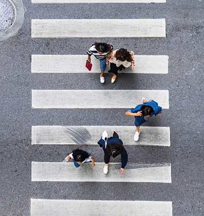 Aerial view of pedestrians using a crosswalk.