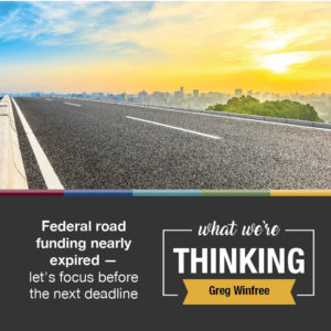 What We're Thinking by Greg Winfree. Federal road funding nearly expired — let's focus before the next deadline. Image: roadway with city in background.