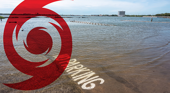 Hurricane icon overlaying a photograph of a flooded area next to Clear Lake in Pasadena, Texas.