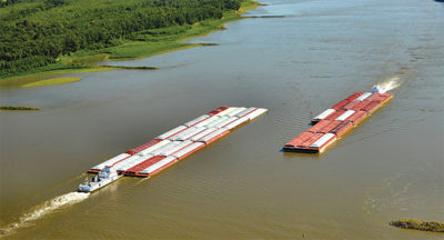Barges moving down the Mississippi River in southeast Missouri.
