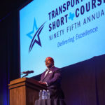 Greg Winfree speaking from the podium during the 2021 Transportation Short Course.