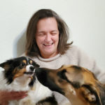 A photo of Jolanda Prozzi and her two dogs.