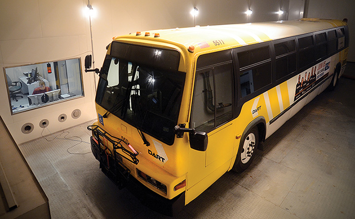 Full-sized transit bus inside the environmental test chamber.