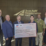photo of TTI and Union Pacific representatives holding a check