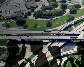 Illustration of people in discussion overlaying an aerial view of a section of the I-35 corridor.