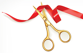 Illustration of a pair of gold scissors cutting a red silk ribbon.