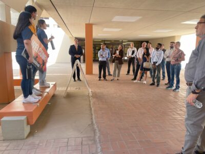 Conference attendees participating in a tour of the UTEP campus led by university staff.