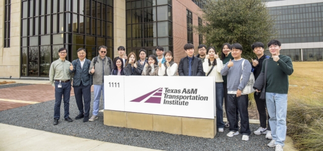Group photo taken outside of the Texas A&M Transportation Institute headquarters building of the KAIST Program visit.