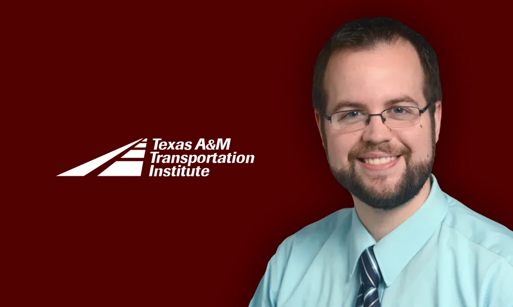 A man in glasses and a tie smiles next to the Texas A&M Transportation Institute logo on a maroon background.
