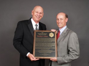 Tim Lomax (right) is presented the Matson Award by ITE President Kenneth Voigt.