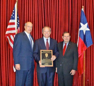 Rep. Chet Edwards (center) receives the TTI Director's Research Champion Award during a ceremony in Washington, D.C. Presenting the award is TTI Director Dennis Christiansen (left) and Director Emeritus Herb Richardson (right), who is a previous recipient of the award.