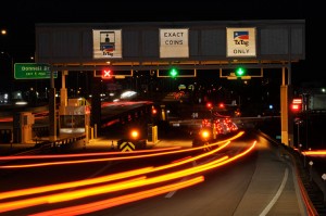 Nighttime time lapse photo of toll booth