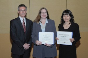 Robert Johns, director of the Volpe National Transportation Center and chair of the TRB Technical Activities Council, presents the 2009 Patricia Waller Award to TTI Senior Research Engineer Kay Fitzpatrick and TTI Associate Research Scientist Eun Sug Park.