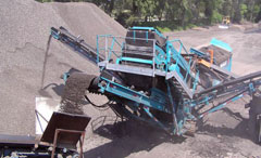 A machine processes an asphalt mix.