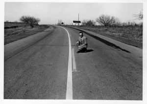 Jack Keese kneeling on roadway