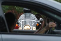motorcyclist seen through driver-side window