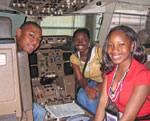 students in a Boeing 767 cockpit