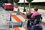 a person in a motorized wheelchair entering a work zone