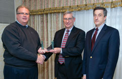 George Dresser receiving the Aviation Group 2012 Francis X. McKelvey Award from Greg Casto with Peter Mandle.