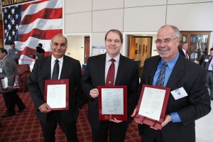 This is a photo of TTI employees with their patent awards.