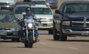 This is a picture of a motorcycle in traffic.