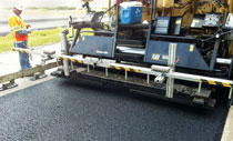 One inch of SMA thin asphalt being placed by a laydown machine.