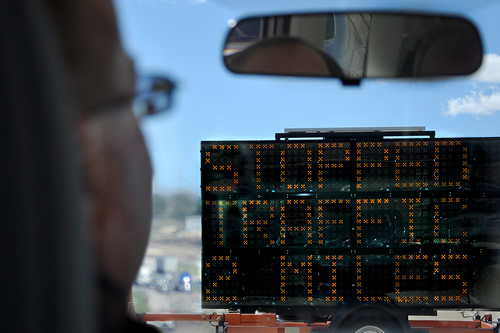 Motorist looking at changeable message sign